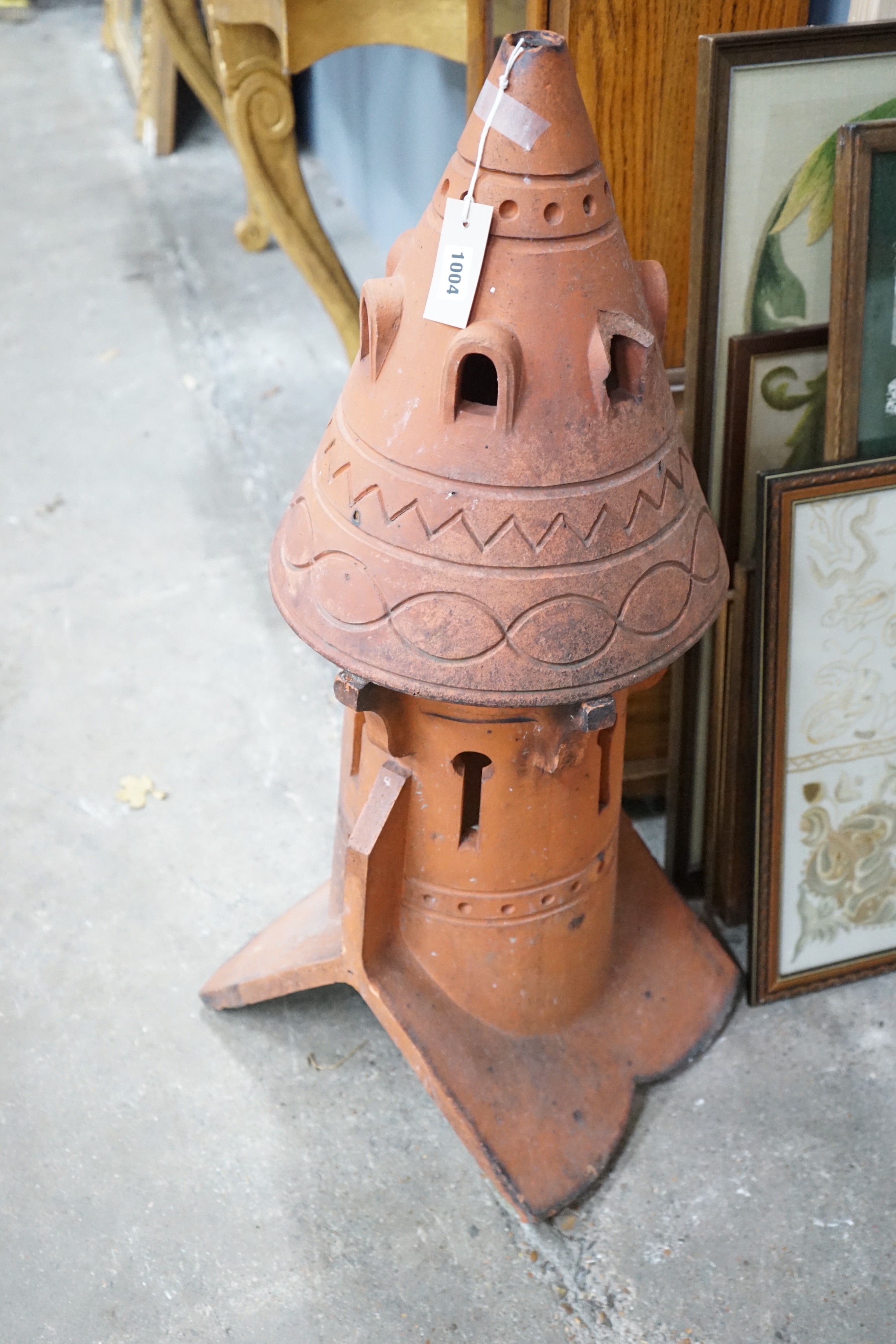 A terracotta dovecote hip tile, height 89cm